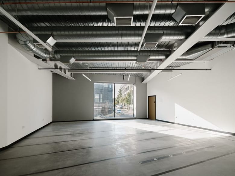Studio 101 industrial venue with high ceilings, perfect for creative workshops and pop-up events.