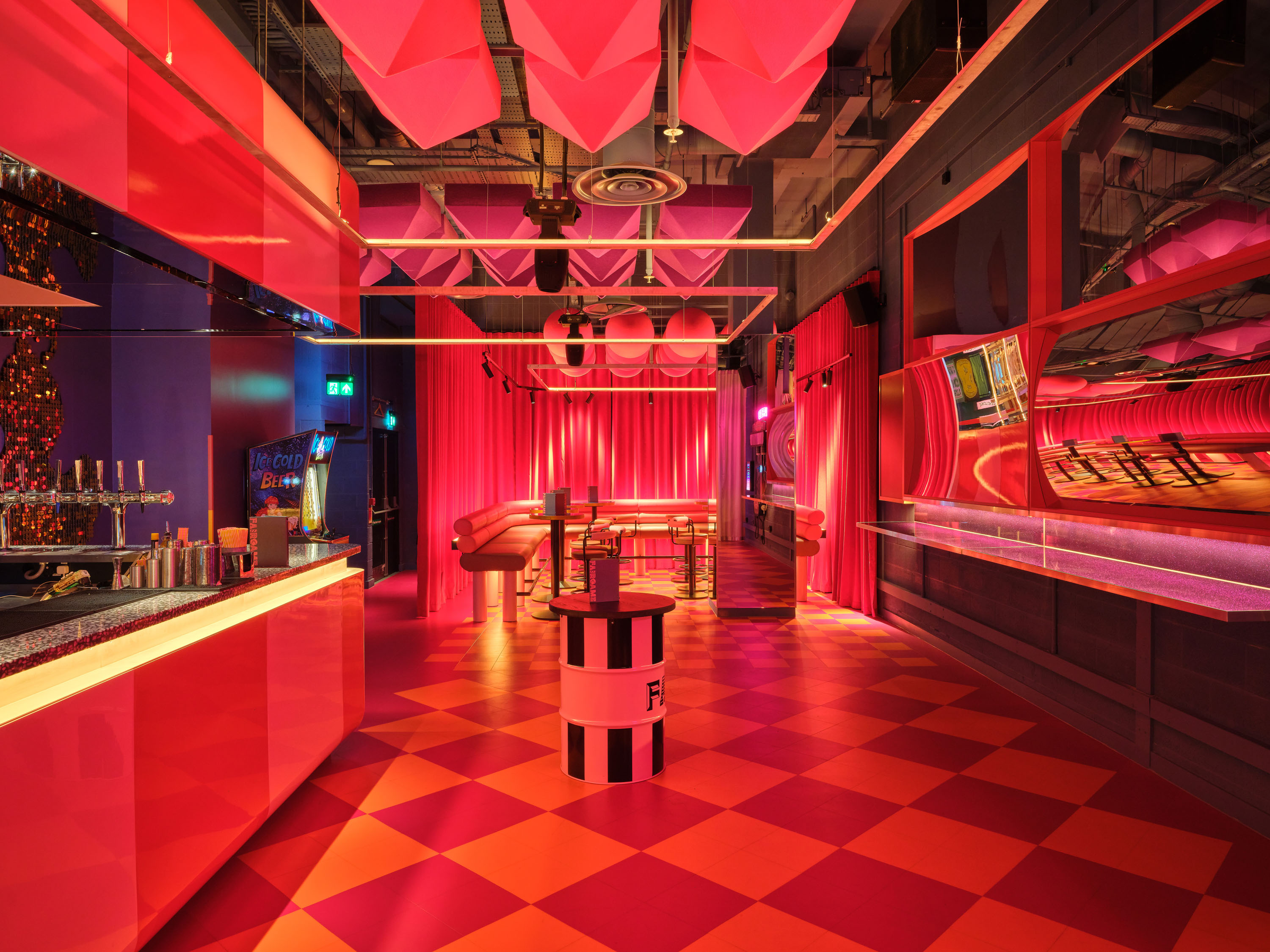 Vibrant 1/2 Fun House event space with geometric flooring for parties and receptions.