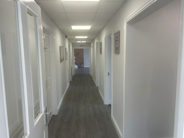 Ruby Rose Health and Wellbeing Centre corridor: functional event breakout space for conferences.