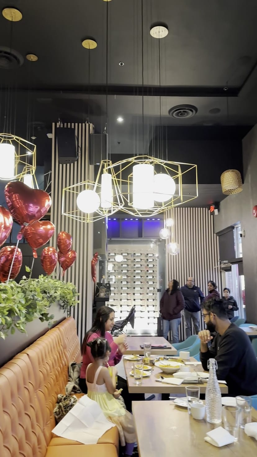 Modern wine bar with heart-shaped balloons, perfect for romantic celebrations and events.