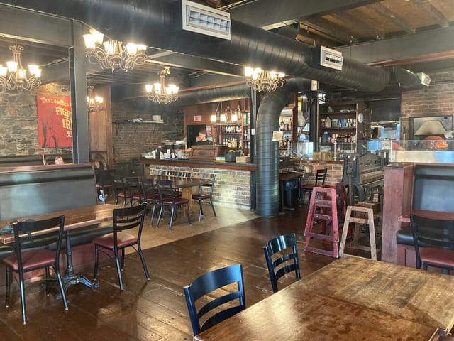 UnderBelly venue at YellowBelly Brewery with cozy seating for events and gatherings.