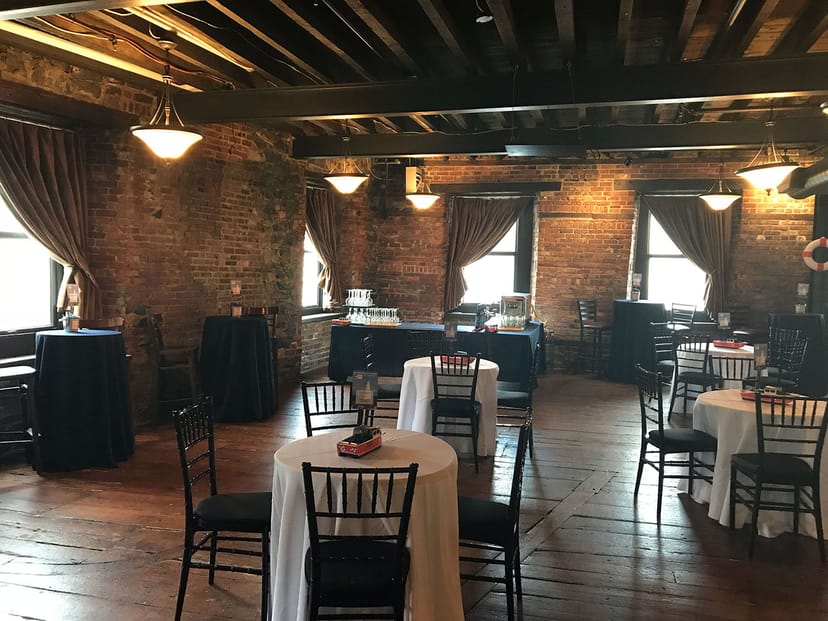 UnderBelly event space at YellowBelly Brewery with rustic brick walls, ideal for gatherings.