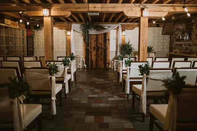 Private wine cellar event space with rustic decor, ideal for intimate receptions.