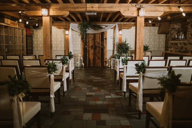 Private wine cellar event space with rustic decor, ideal for intimate receptions.