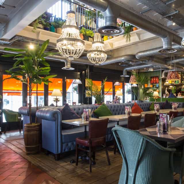 Vibrant meeting venue with comfortable seating and stylish lighting at Bill's Exeter Restaurant.