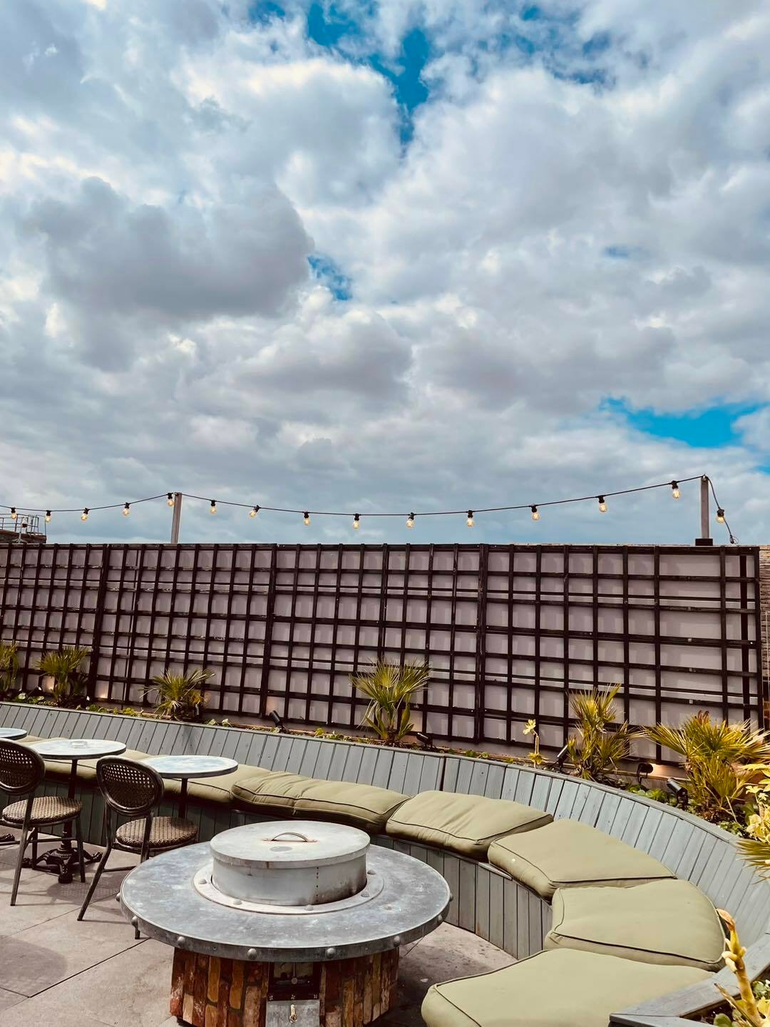 Outdoor event space at The Botanist Exeter with decorative string lights for gatherings.