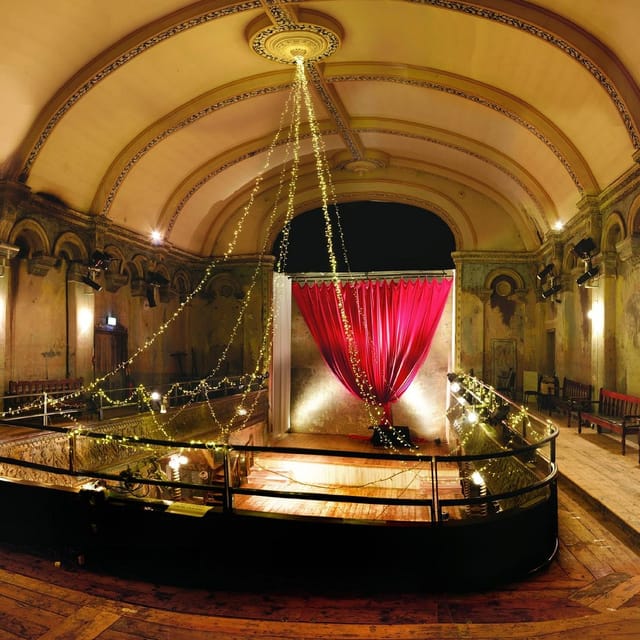 Elegant Ballroom + Chapel with red drapery, ideal for weddings and upscale events.