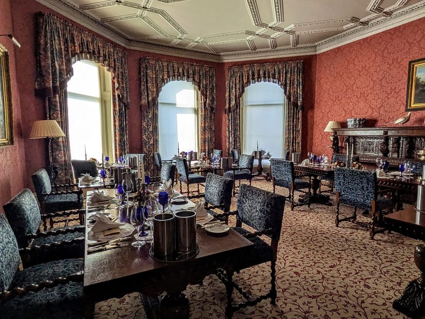 Elegant dining room at Inverlochy Castle, ideal for formal meetings and upscale events.