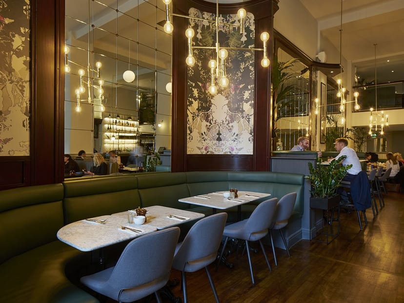 Sophisticated Browns restaurant banquette seating for high-end corporate networking dinners.