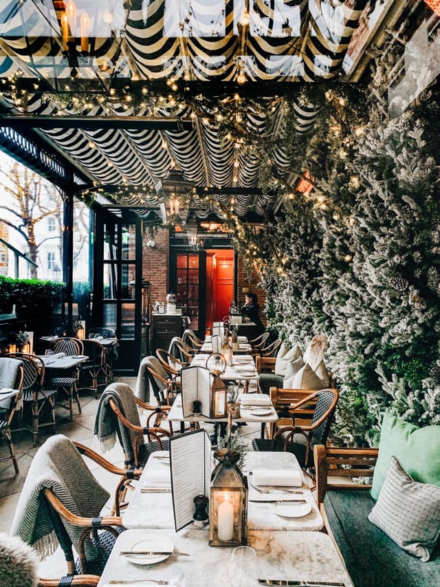 Elegant event venue with lush greenery, perfect for holiday parties and gatherings.