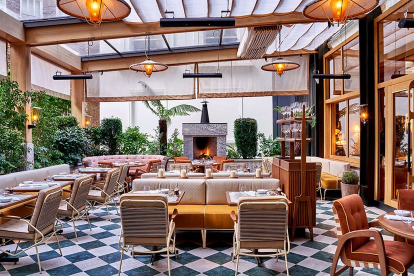 Stylish indoor-outdoor venue with greenery, ideal for intimate gatherings and corporate events.