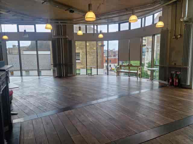 Spacious David Jacobs Room with large windows, perfect for meetings and workshops.