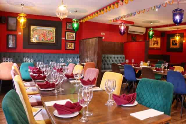 Private dining room in The Chennai Lounge, vibrant decor for intimate gatherings and celebrations.