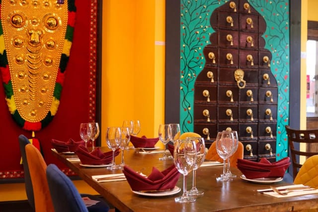 Private dining room at The Chennai Lounge, vibrant decor for cultural dinners and intimate events.