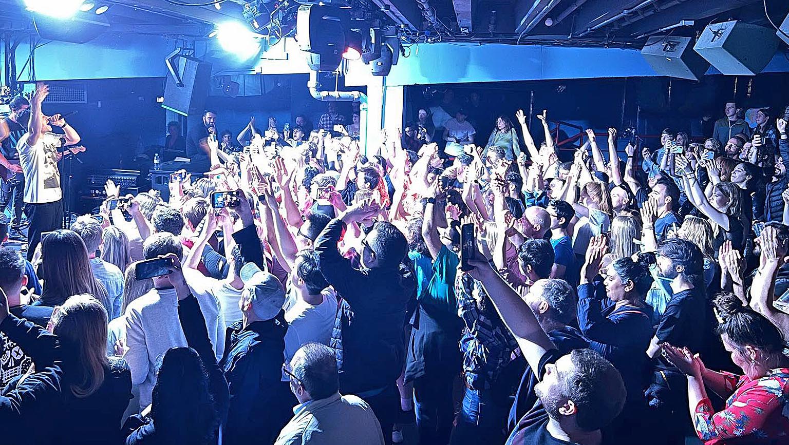 Main Hall T.E Dingwall Building, vibrant event with engaged audience and energetic ambiance. - Banner