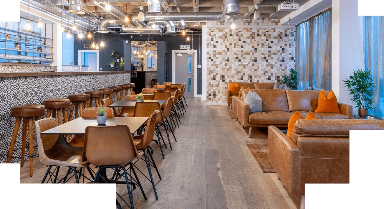 Versatile meeting space with cozy seating for networking events and creative sessions. - Banner