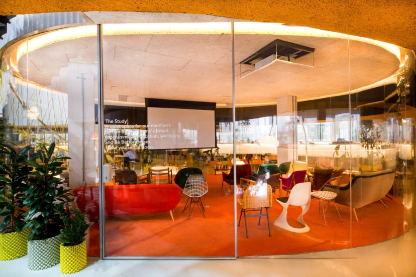 Modern workshop space with circular layout and glass walls at Second Home Spitalfields.