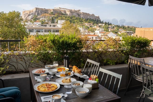 Rooftop dining setup with vibrant breakfast spread for networking events and meetings.