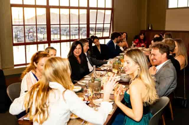 Full restaurant buyout at Okio featuring elegant dinner meeting setup and scenic view.
