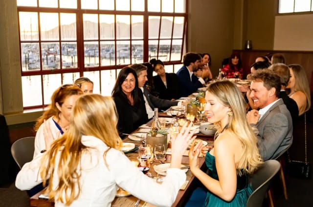 Full restaurant buyout at Okio featuring elegant dinner meeting setup and scenic view.