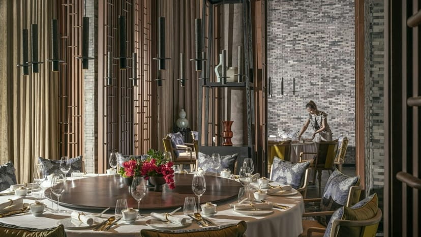 Elegant round table setup for a full restaurant buyout at Okio, ideal for upscale events.