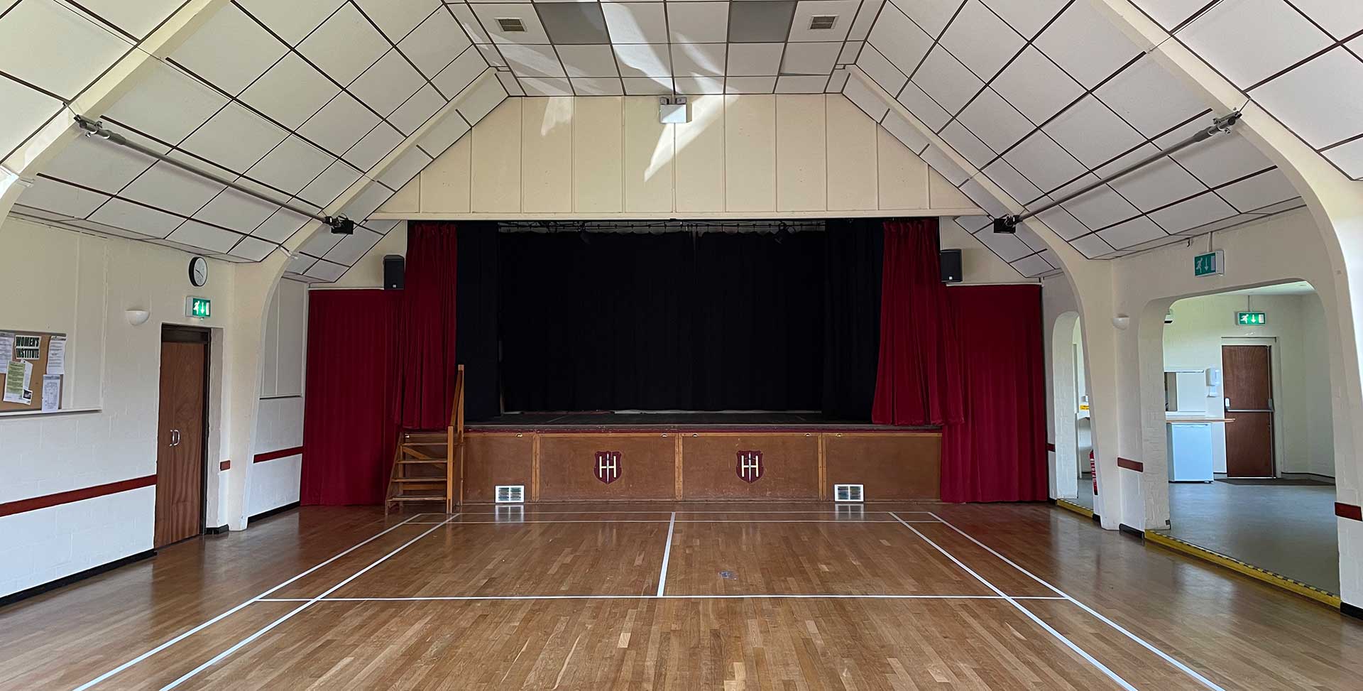 Main Hall in Holyport Memorial Hall with stage, ideal for events and presentations.