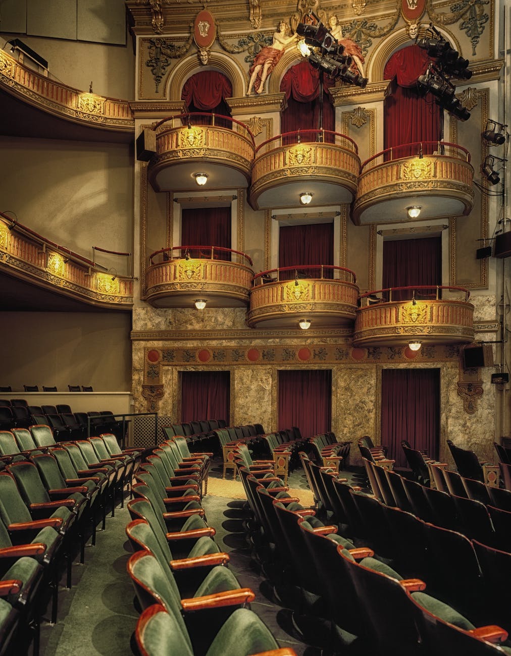 Elegant theater interior with tiered seating, ideal for performances and conferences.