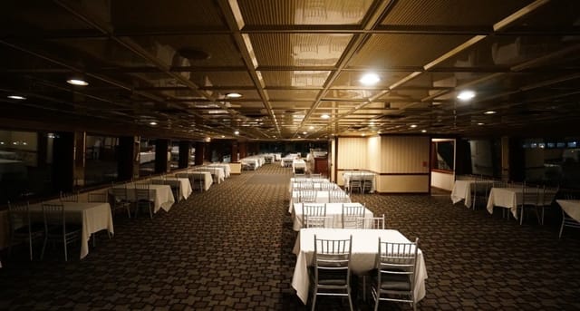 Timeless Mega Yacht setup for elegant corporate events with white table linens.