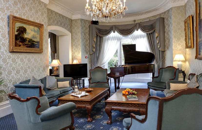Adamson Suite with grand piano for luxury VIP board meetings and private dining.