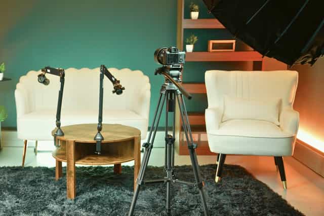 Cozy podcast recording studio with adjustable lighting for virtual events in London.
