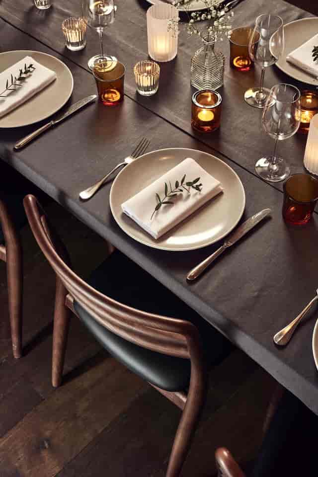 Elegant vaulted private dining room with sophisticated table set for upscale events.