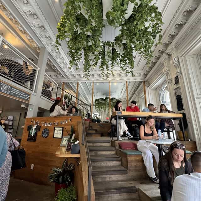 Trendy upstairs bar venue with natural light, ideal for meetings and networking events.