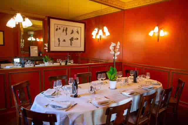 Elegant dining room for intimate corporate events with sophisticated decor.