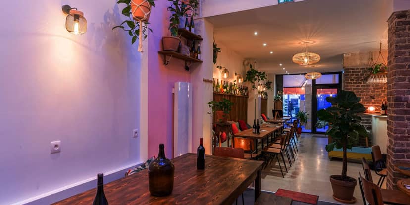 Main Dining Room at Les Bariolés de Maud, stylish event space with warm lighting.
