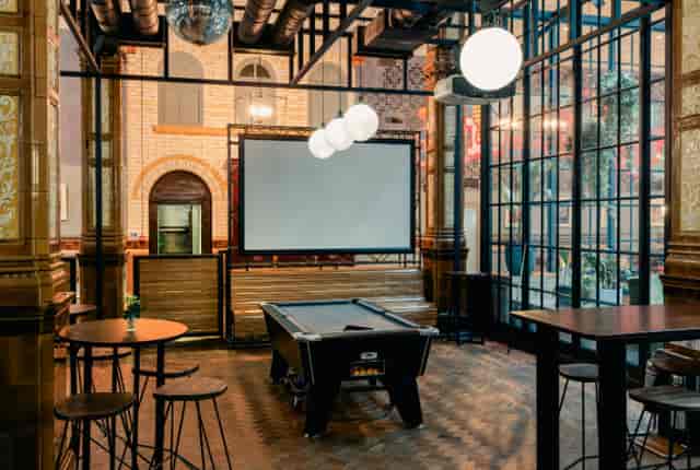Industrial-chic breakout space at The Refuge Manchester, perfect for corporate events and workshops.