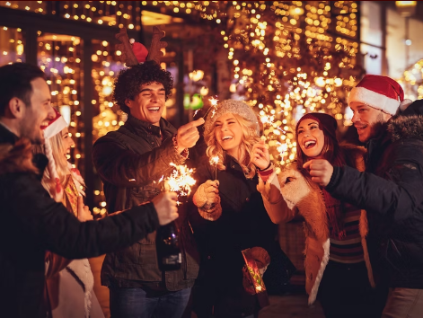 Outdoor holiday corporate mixer at The Residence Bar & Kitchen with ambient festive lighting. - Banner
