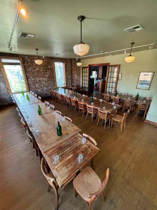 Spacious Second Floor Event Space at Firehouse Restaurant with rustic wooden tables.