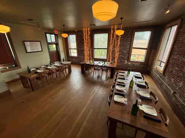 Rustic event space with exposed brick, ideal for upscale gatherings and corporate events.