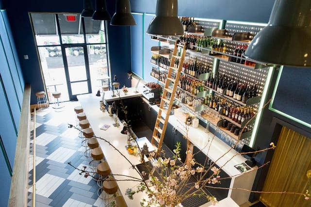 Modern bar area at Enoteca Alto, ideal for networking events and social gatherings.