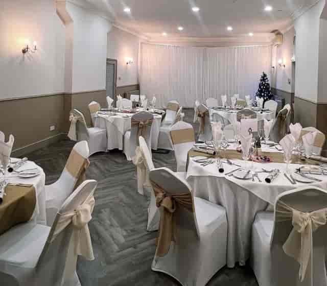 Yarm Suite dining area with white linens, perfect for weddings and corporate events.