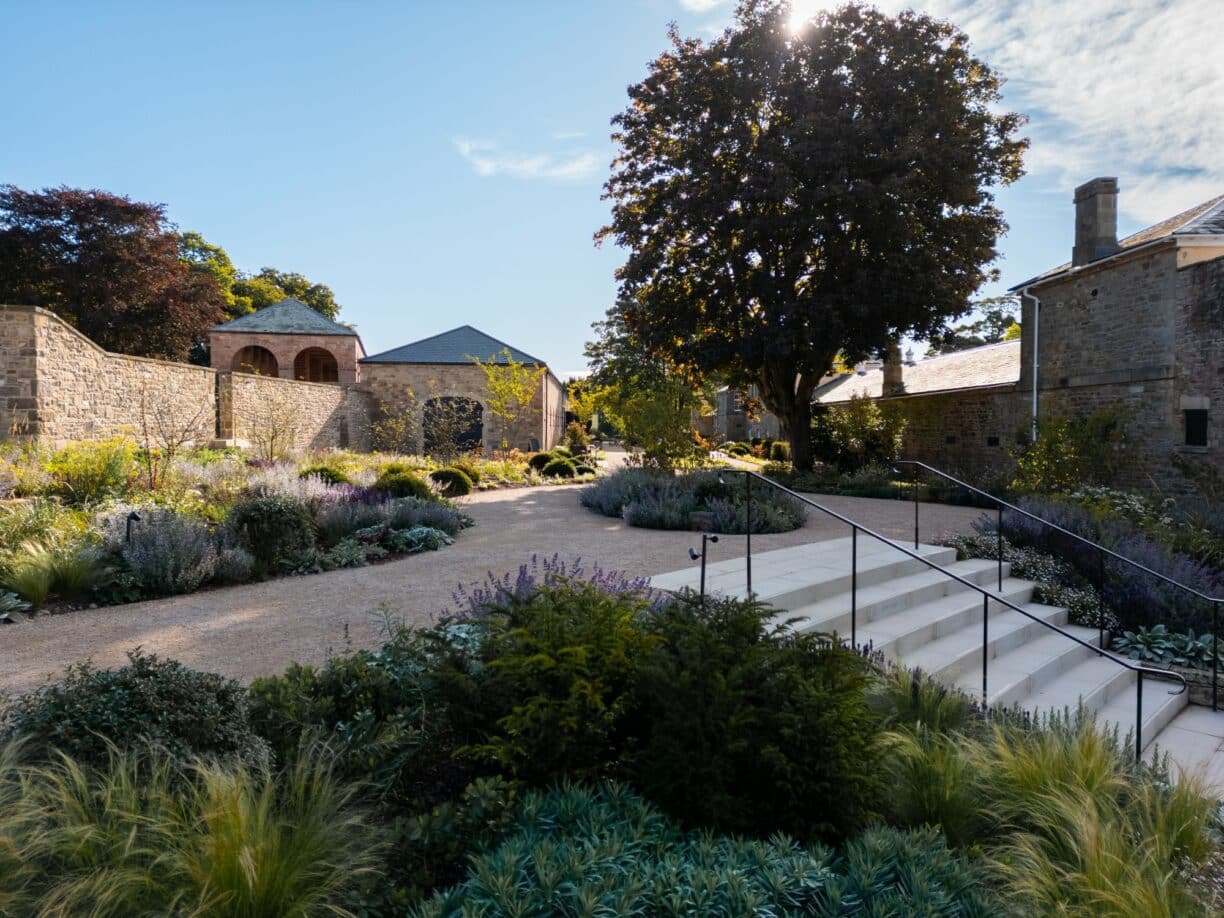 Dutch Barn at Raby Castle: scenic outdoor venue for weddings and events. - Banner