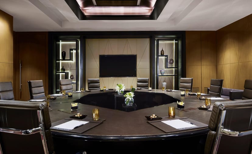 JW Marriott Mumbai Sahar boardroom with circular table for executive meetings and corporate events.