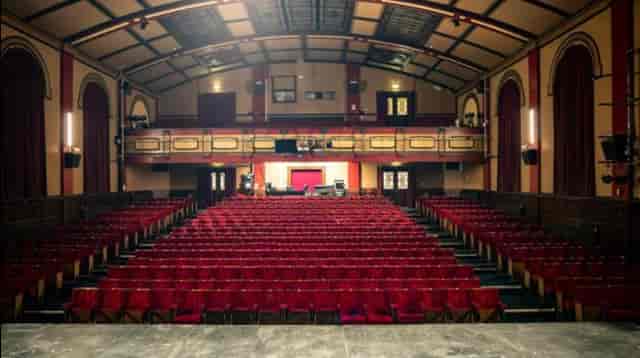 Main Auditorium at Albany Theatre, Coventry: Proscenium stage for keynotes and performing arts.