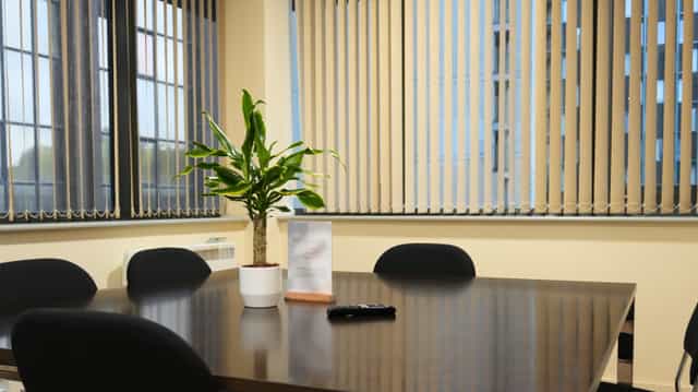 Orange Room breakout space with dated decor for professional event planning or meeting room rental.