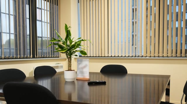 Orange Room breakout space with dated decor for professional event planning or meeting room rental.