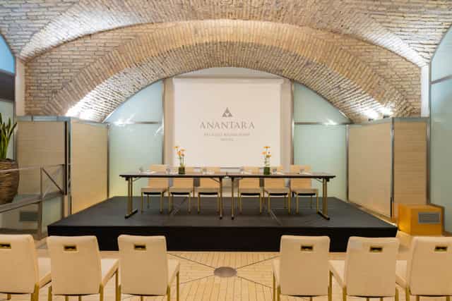 Panel discussion setup at The Diocleziano, Anantara Palazzo Naiadi, Rome. Elegant event space.