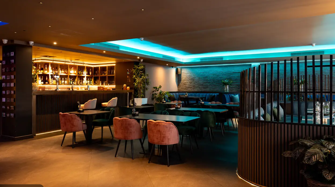 Modern Embassy Lounge Bar, warm lighting, ideal for networking events and private gatherings. - Banner