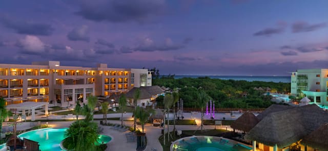 Ceiba Ballroom at Paradisus Playa del Carmen: tropical evening networking event and retreat venue.