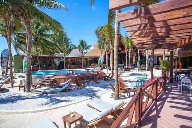 Exclusive beachfront venue with inviting pool for corporate retreats and social events.