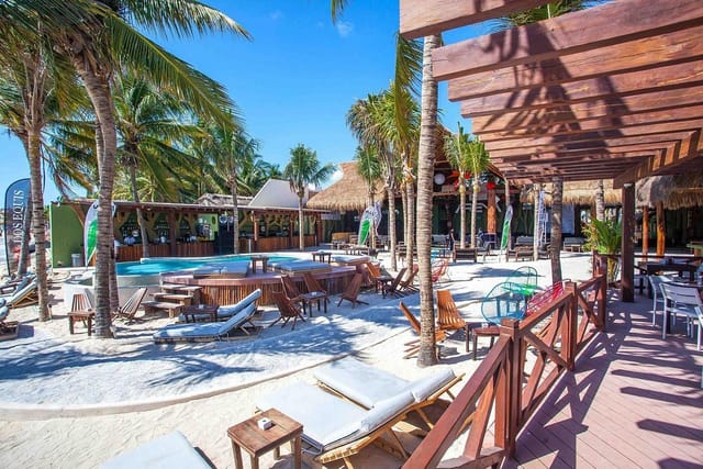 Exclusive beachfront venue with inviting pool for corporate retreats and social events.